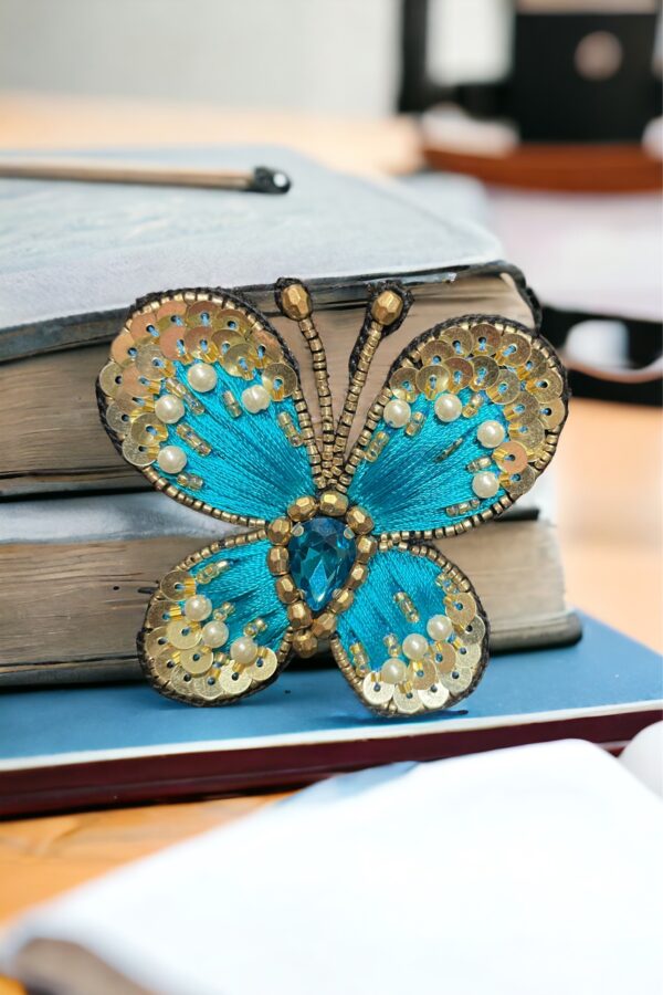 Blue butterfly brooch