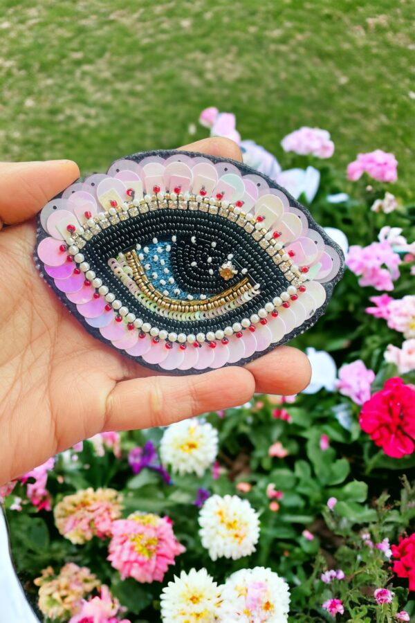 baby pink evil eye brooch