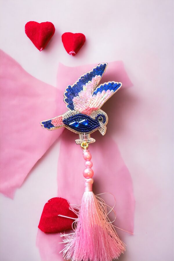 Pink & blue bird with tassels