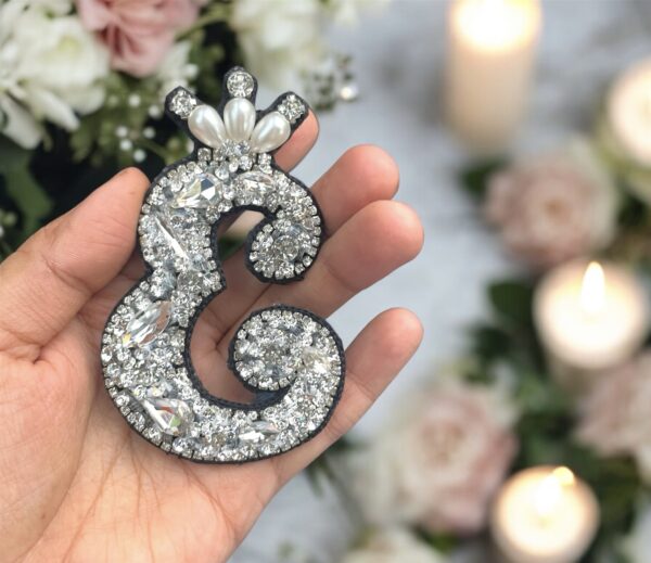 The silver blingy initials