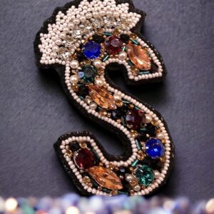 Initial brooch
