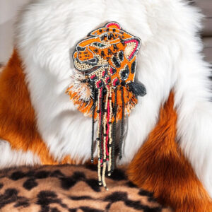 Jaguar brooch with strings